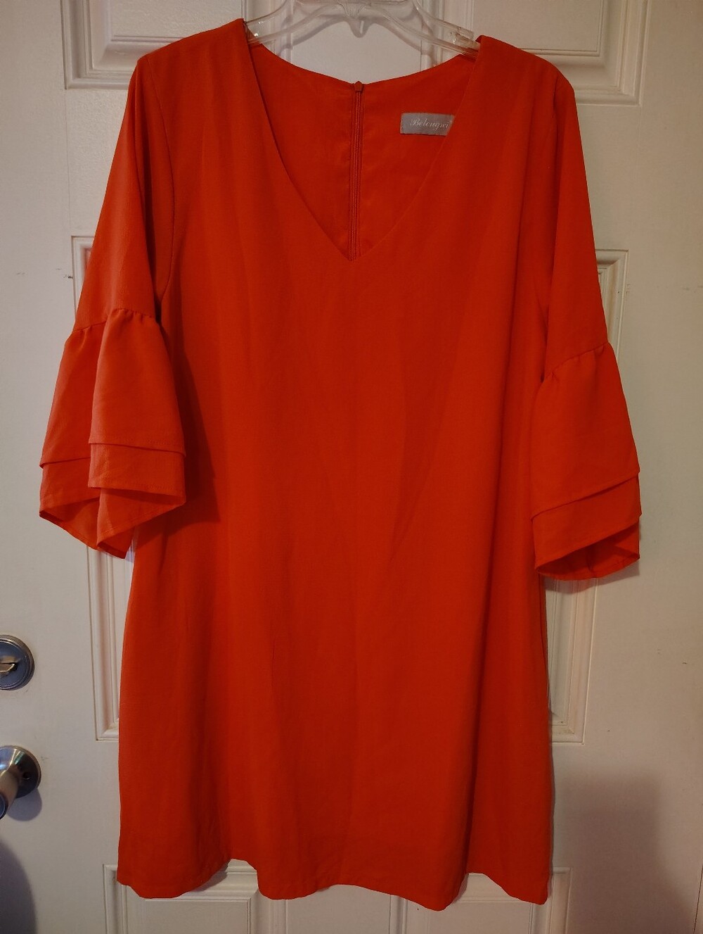 This Belongsci dress features a bright Orange V Neck XL